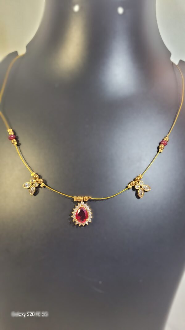 Gold-Plated Ruby Drop with Floral Accents